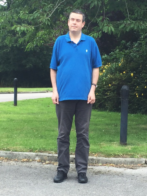 Photo of Martin Rigby standing in the garden.